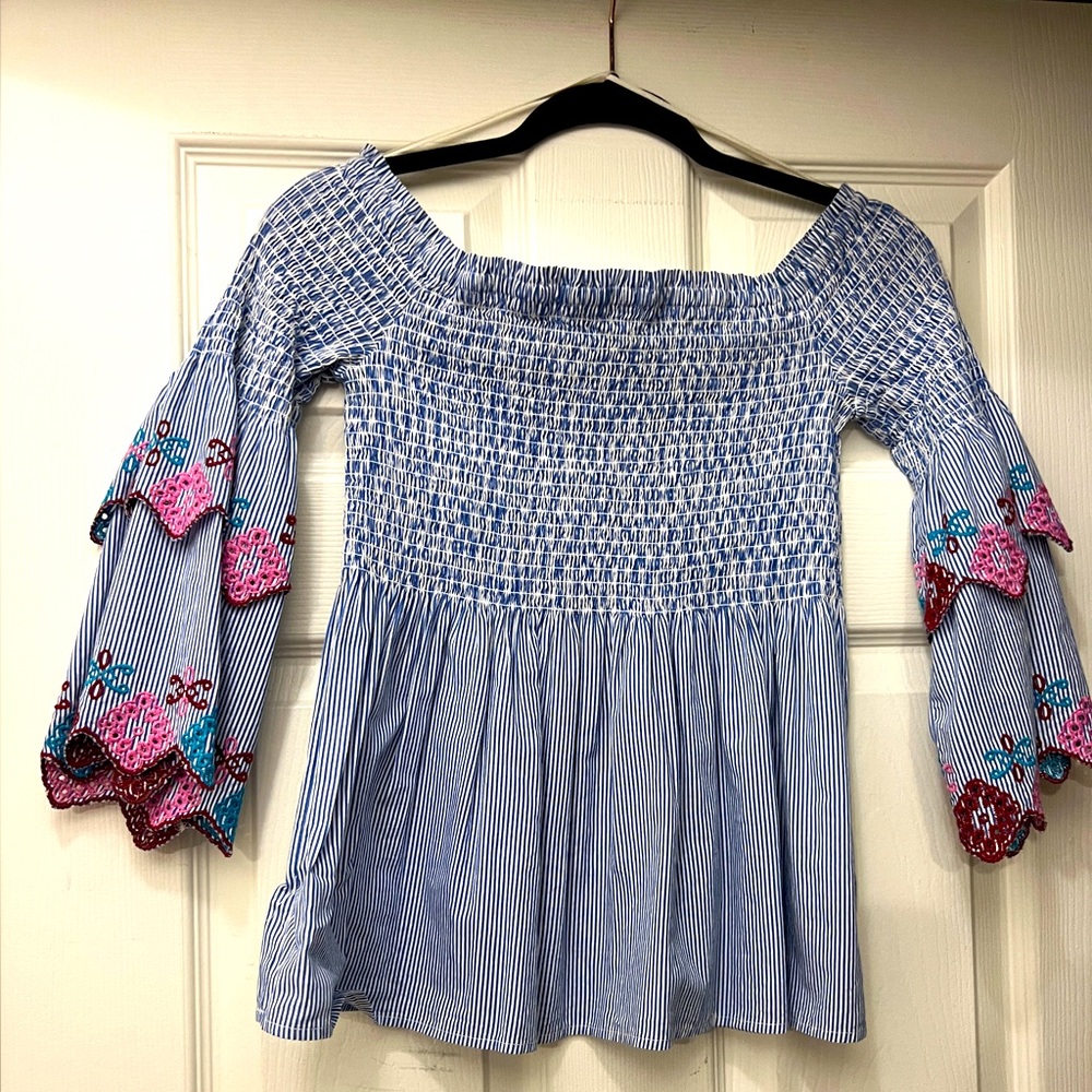 Ruched bodice off-the-shoulder top, with embroidery details.